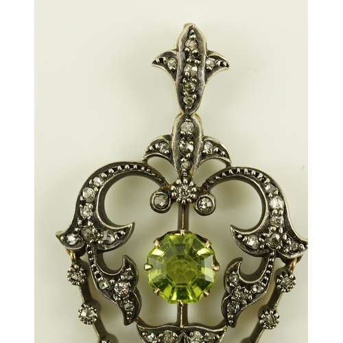 146 - A Victorian gold and silver, peridot and diamond cluster set articulated drop pendant, with octagona... 