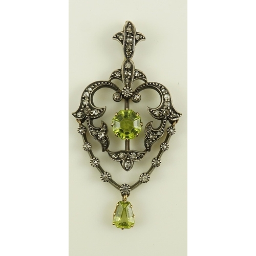 146 - A Victorian gold and silver, peridot and diamond cluster set articulated drop pendant, with octagona... 