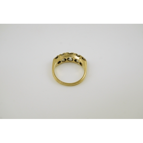 148 - An antique gold and graduated five stone old mine cut diamond set half hoop ring, total diamond weig... 