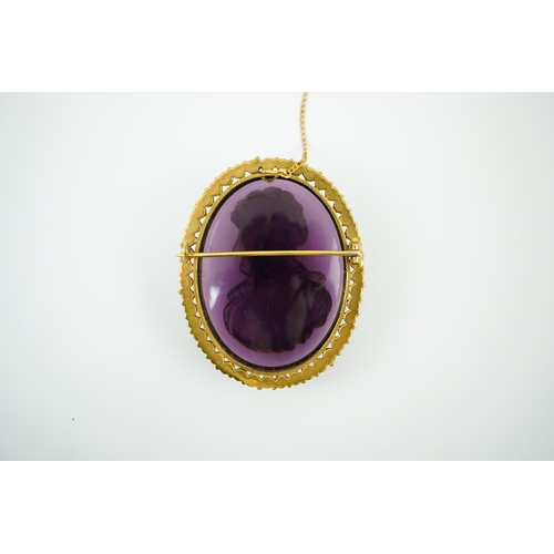 149 - A late 19th/early 20th century gold and turquoise enamel? mounted oval amethyst paste set brooch, ca... 