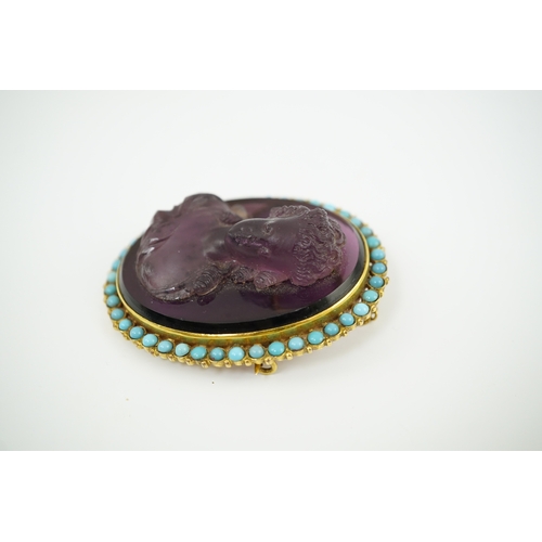 149 - A late 19th/early 20th century gold and turquoise enamel? mounted oval amethyst paste set brooch, ca... 