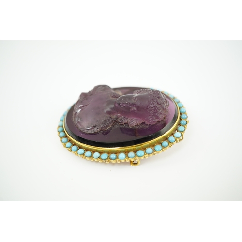 149 - A late 19th/early 20th century gold and turquoise enamel? mounted oval amethyst paste set brooch, ca... 