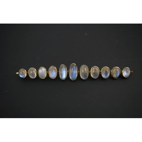 154 - A gold and eleven stone graduated cabochon moonstone set bar brooch, 89mm, gross weight 9.5 grams.... 