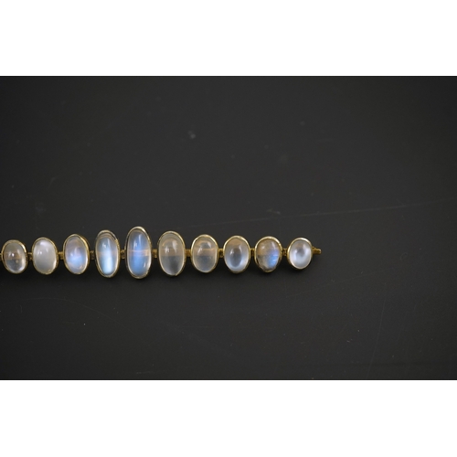 154 - A gold and eleven stone graduated cabochon moonstone set bar brooch, 89mm, gross weight 9.5 grams.... 