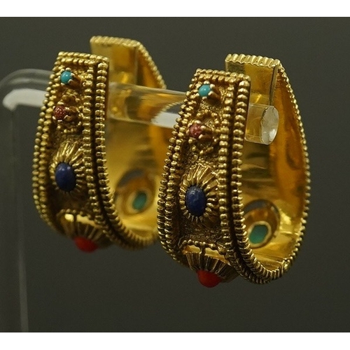 156 - A pair of continental high carat gold and semi-precious gem set hinged  loop earrings, possibly Indi... 