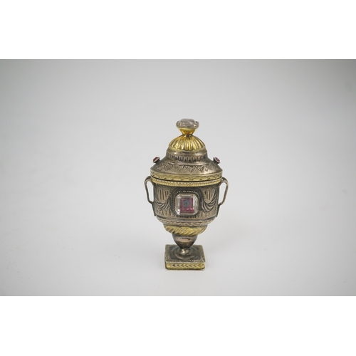 16 - A 19th century continental parcel gilt silver and gem set double ended pill box, modelled as a two h... 