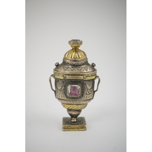 16 - A 19th century continental parcel gilt silver and gem set double ended pill box, modelled as a two h... 