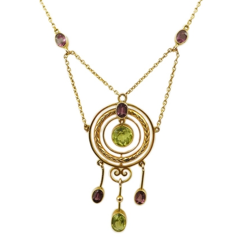 164 - An Edwardian 9ct gold, peridot and garnet set drop pendant necklace, by Murrle Bennett & Co, of targ... 