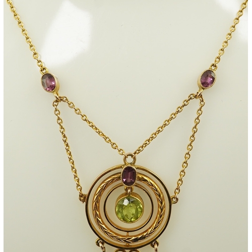 164 - An Edwardian 9ct gold, peridot and garnet set drop pendant necklace, by Murrle Bennett & Co, of targ... 