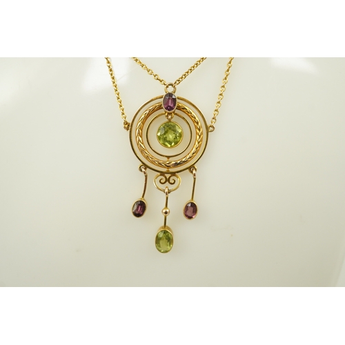 164 - An Edwardian 9ct gold, peridot and garnet set drop pendant necklace, by Murrle Bennett & Co, of targ... 