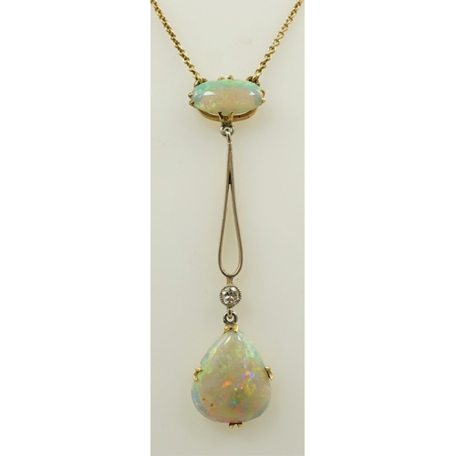 167 - An early 20th century gold, two stone white opal and single stone diamond set drop pendant necklace,... 