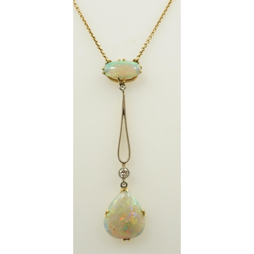 167 - An early 20th century gold, two stone white opal and single stone diamond set drop pendant necklace,... 