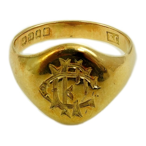 169 - An early 20th century 18ct gold signet ring, carved with a monogram, size P, 8.4 grams.