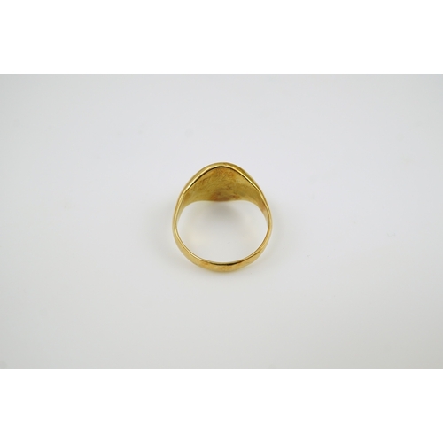 169 - An early 20th century 18ct gold signet ring, carved with a monogram, size P, 8.4 grams.