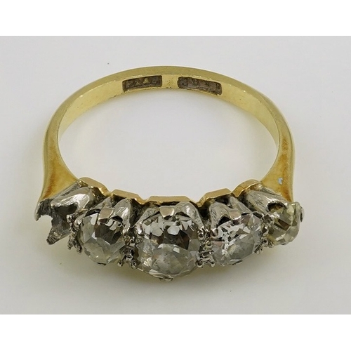 172 - An early 20th century 18ct gold, platinum and graduated five stone old mine cut diamond set half hoo... 