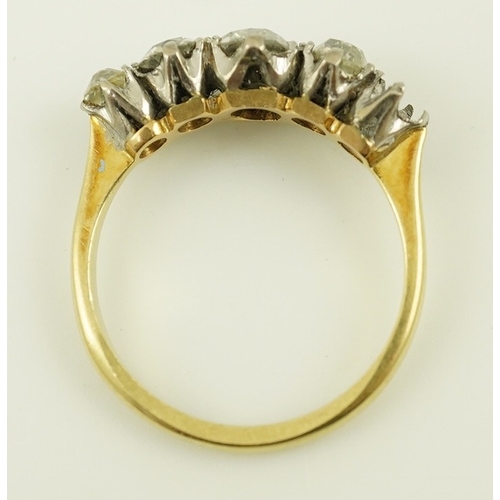 172 - An early 20th century 18ct gold, platinum and graduated five stone old mine cut diamond set half hoo... 