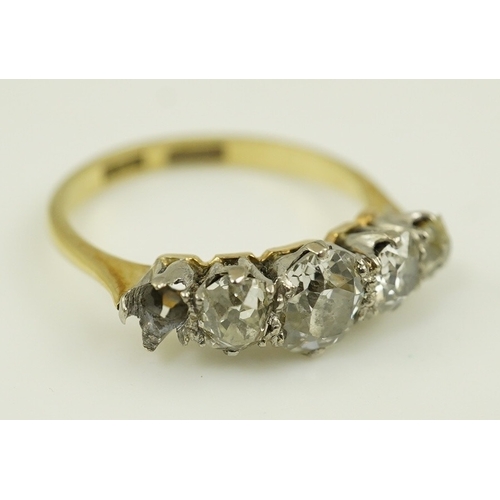 172 - An early 20th century 18ct gold, platinum and graduated five stone old mine cut diamond set half hoo... 