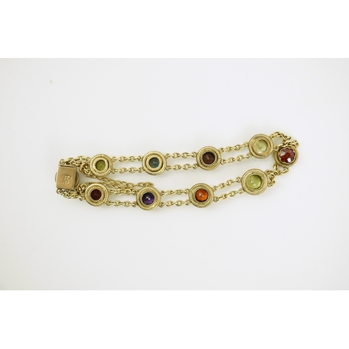 174 - An early 20th century yellow metal and ten stone multi gem set chain link bracelet, 16cm, gross weig... 