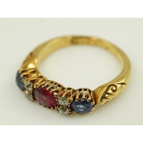 175 - An early 20th century gold, ruby, sapphire and diamond cluster set half hoop ring, size J, gross wei... 