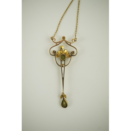 178 - An early 20th century style gold, peridot and seed pearl set drop pendant, on an 18k gold chain, pen... 