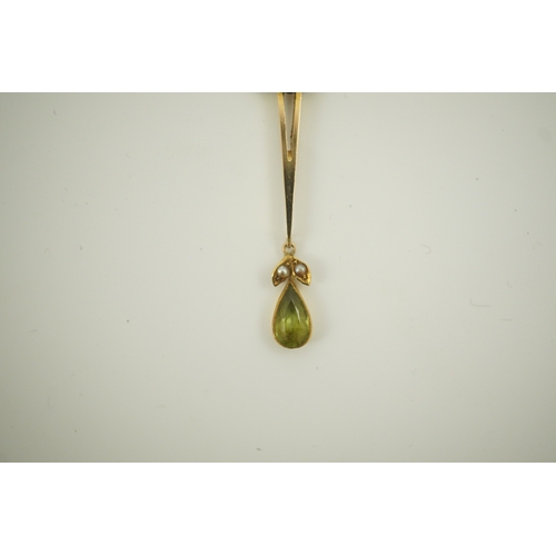 178 - An early 20th century style gold, peridot and seed pearl set drop pendant, on an 18k gold chain, pen... 