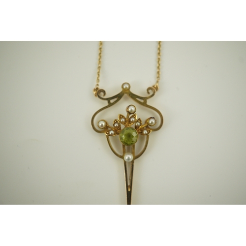 178 - An early 20th century style gold, peridot and seed pearl set drop pendant, on an 18k gold chain, pen... 