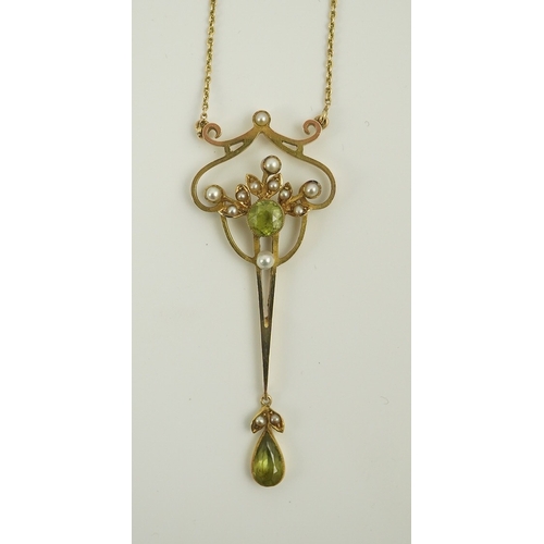 178 - An early 20th century style gold, peridot and seed pearl set drop pendant, on an 18k gold chain, pen... 