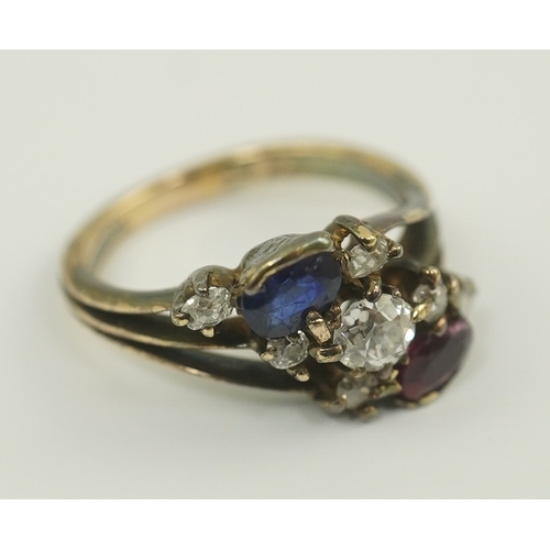 180 - An early 20th century style gold, ruby, sapphire and diamond cluster set triple shank ring, size P/Q... 