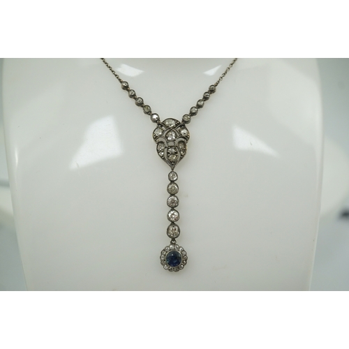 181 - A Belle Epoque gold and silver, millegrain set sapphire and diamond cluster set drop pendant necklac... 