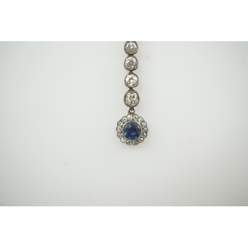 181 - A Belle Epoque gold and silver, millegrain set sapphire and diamond cluster set drop pendant necklac... 