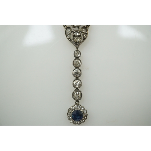 181 - A Belle Epoque gold and silver, millegrain set sapphire and diamond cluster set drop pendant necklac... 