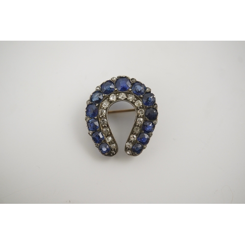 183 - An Edwardian, gold and silver, diamond and sapphire set horse shoe brooch, 24mm, gross weight 4.6 ... 