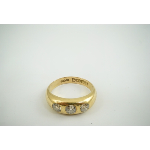 184 - An Edwardian 18ct gold and gypsy set three stone diamond ring, size R, gross weight 8.1 grams.... 