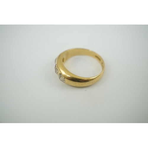 184 - An Edwardian 18ct gold and gypsy set three stone diamond ring, size R, gross weight 8.1 grams.... 