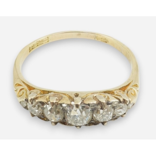 191 - An early 20th century gold and graduated five stone old cut diamond set half hoop ring, with diamond... 