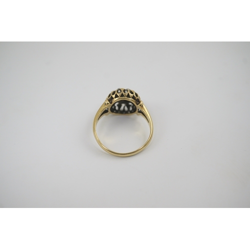 192 - An early to mid 20th century gold and diamond set circular cluster ring, size M/N, gross weight 4.1 ... 