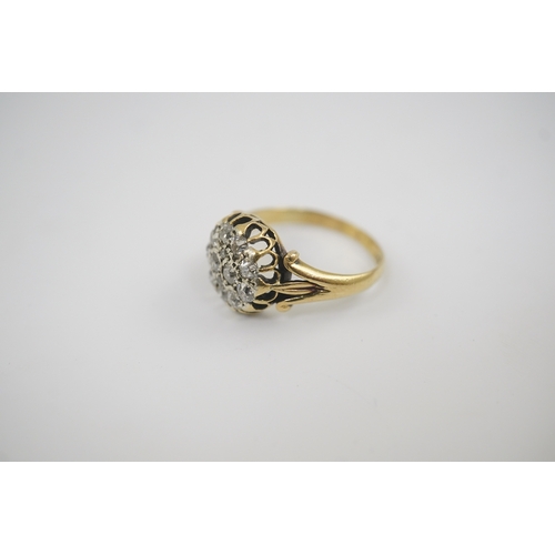 192 - An early to mid 20th century gold and diamond set circular cluster ring, size M/N, gross weight 4.1 ... 