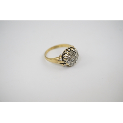 192 - An early to mid 20th century gold and diamond set circular cluster ring, size M/N, gross weight 4.1 ... 