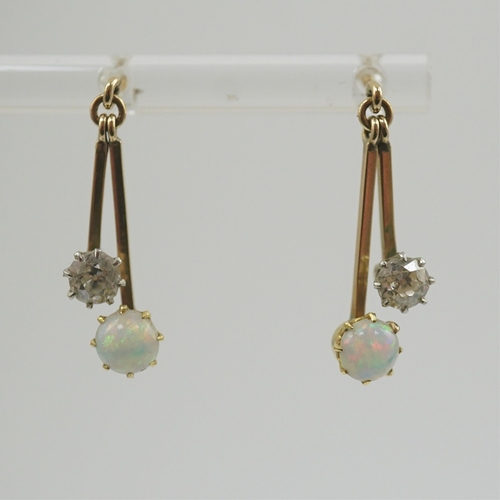 193 - A pair of 9ct gold, white opal and diamond set double drop earrings, 23mm, gross weight 2.2 grams.... 