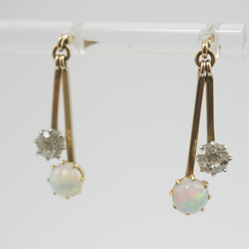 193 - A pair of 9ct gold, white opal and diamond set double drop earrings, 23mm, gross weight 2.2 grams.... 