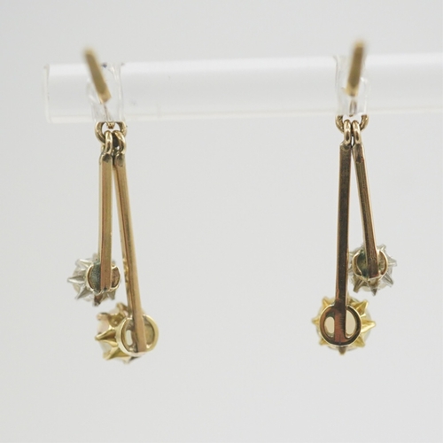 193 - A pair of 9ct gold, white opal and diamond set double drop earrings, 23mm, gross weight 2.2 grams.... 