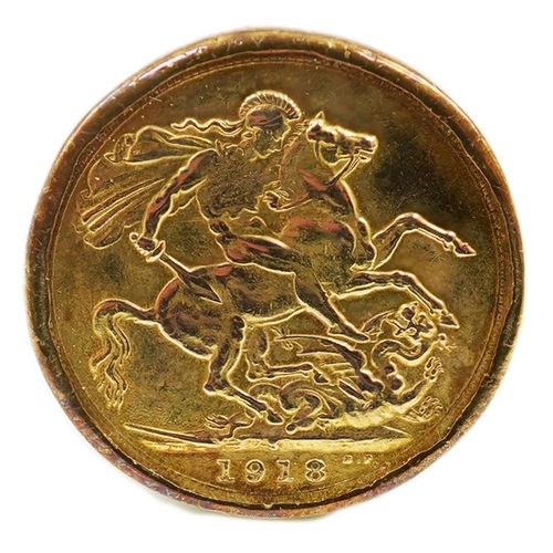 194 - A George V 1918 gold sovereign, in a 9ct gold ring mount, size X/Y, gross weight 12 grams.