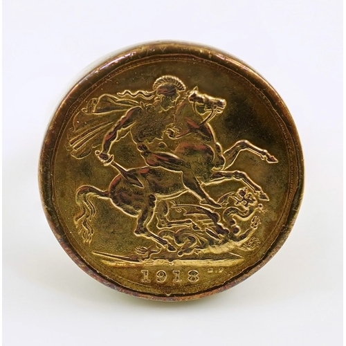 194 - A George V 1918 gold sovereign, in a 9ct gold ring mount, size X/Y, gross weight 12 grams.