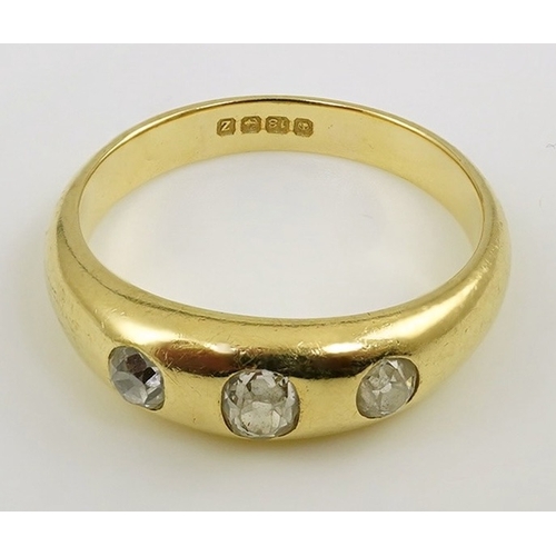 197 - A George V 18ct gold and three stone gypsy set diamond ring, size S, gross weight 6.8 grams.