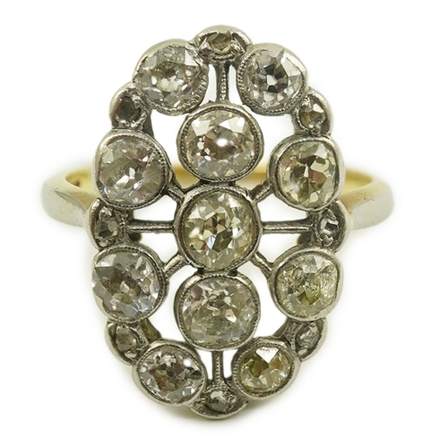 198 - A 1940's 18ct gold, platinum and millegrain set diamond oval cluster ring, size O, gross weight 5 gr... 