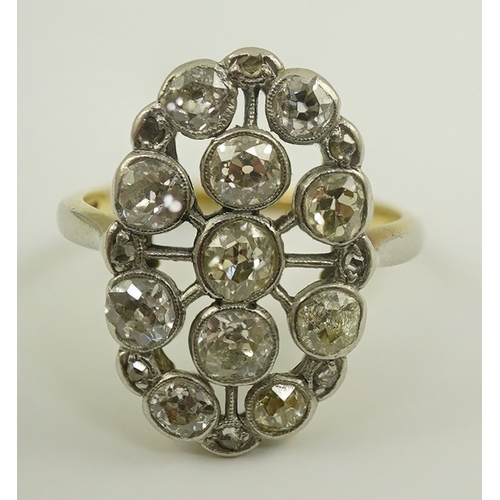 198 - A 1940's 18ct gold, platinum and millegrain set diamond oval cluster ring, size O, gross weight 5 gr... 