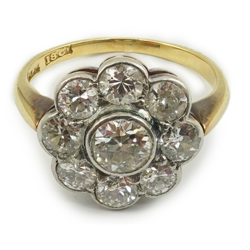 199 - A mid 20th century 18ct gold and nine stone diamond set flower head cluster ring, size L, gross weig... 