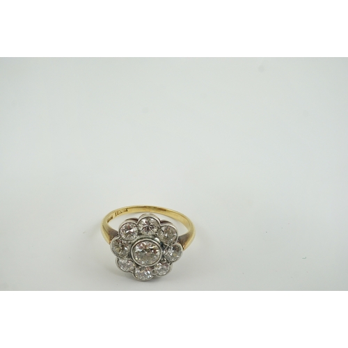 199 - A mid 20th century 18ct gold and nine stone diamond set flower head cluster ring, size L, gross weig... 