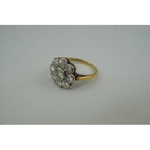 199 - A mid 20th century 18ct gold and nine stone diamond set flower head cluster ring, size L, gross weig... 