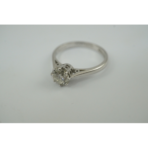 200 - A modern platinum and solitaire diamond set ring, the round brilliant cut stone weighing approximate... 